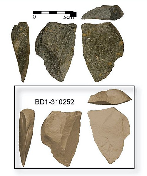Image at left:  Stone Tools.  Image on right:  Large city with skyscrapers.  See text.